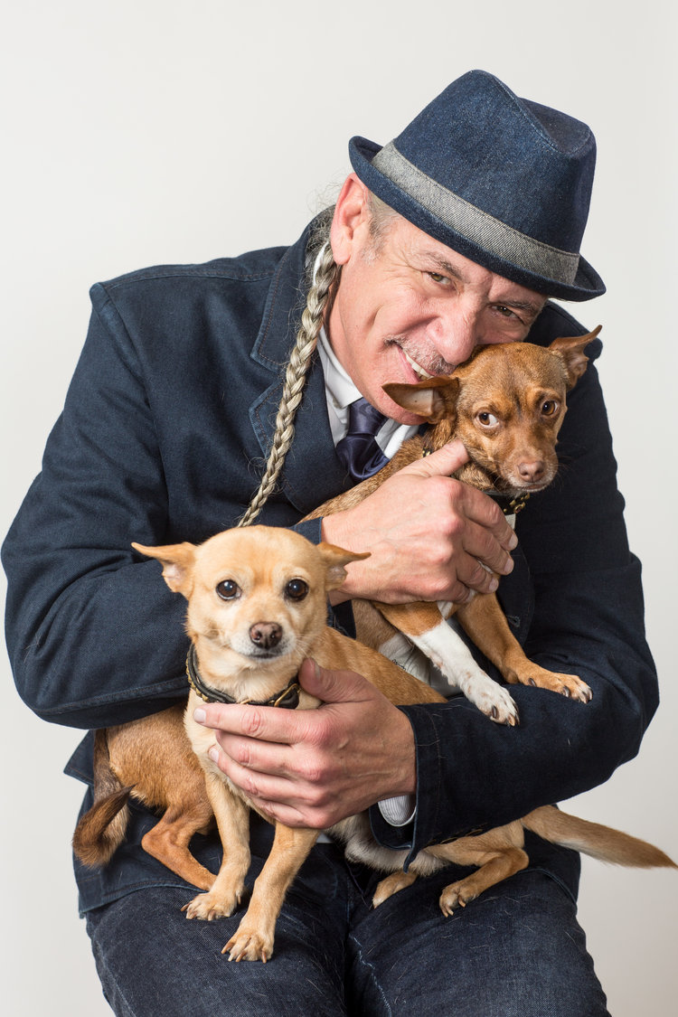 Steve DeAngelo holding happy chihuahuas